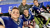 Laith Wallschleger as Rob Gronkowski takes a selfie with castmates